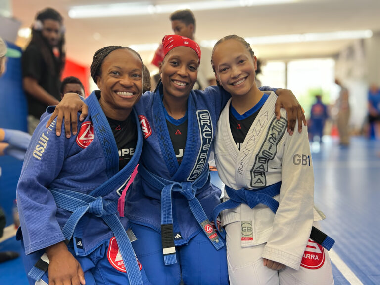Three smiling Gracie Barra Princeton adult Jiu-Jitsu students