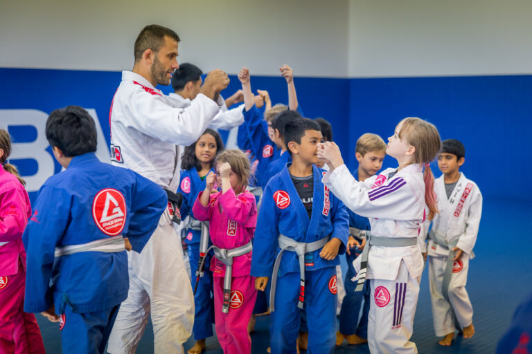 Kids and teens practicing Jiu-Jitsu with their Professor at Gracie Barra Princeton